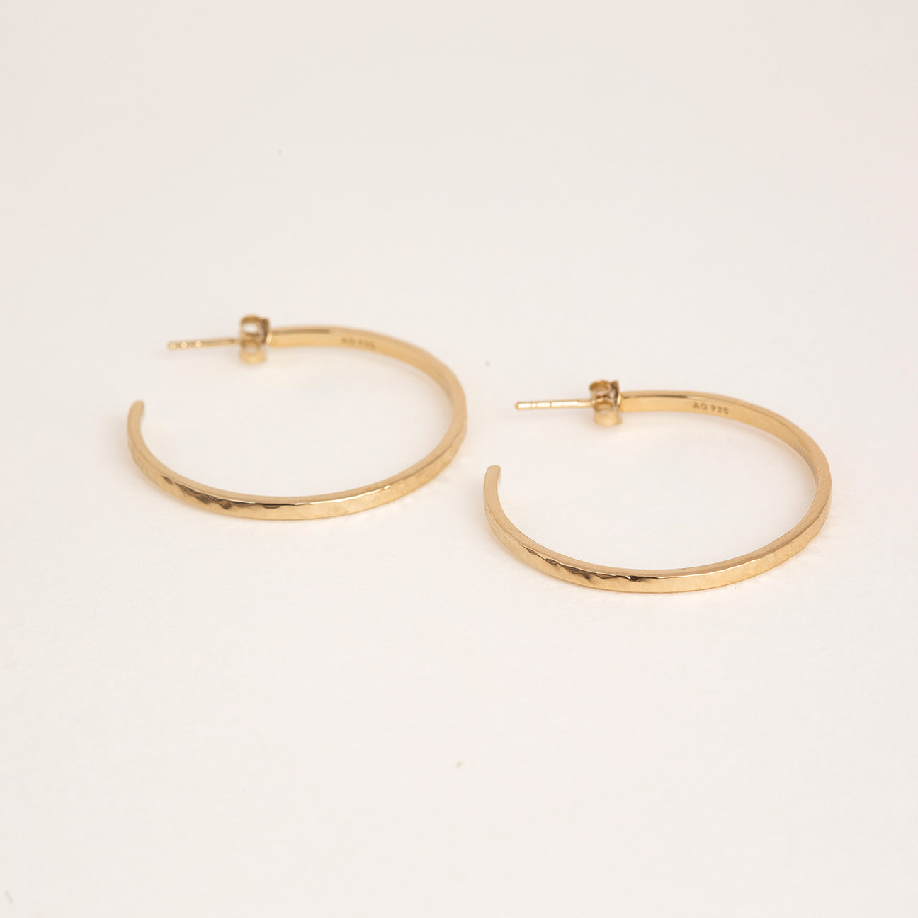 Thin hammered gold hoop on sale earrings