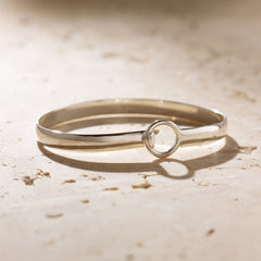 Silver bracelet on stone background