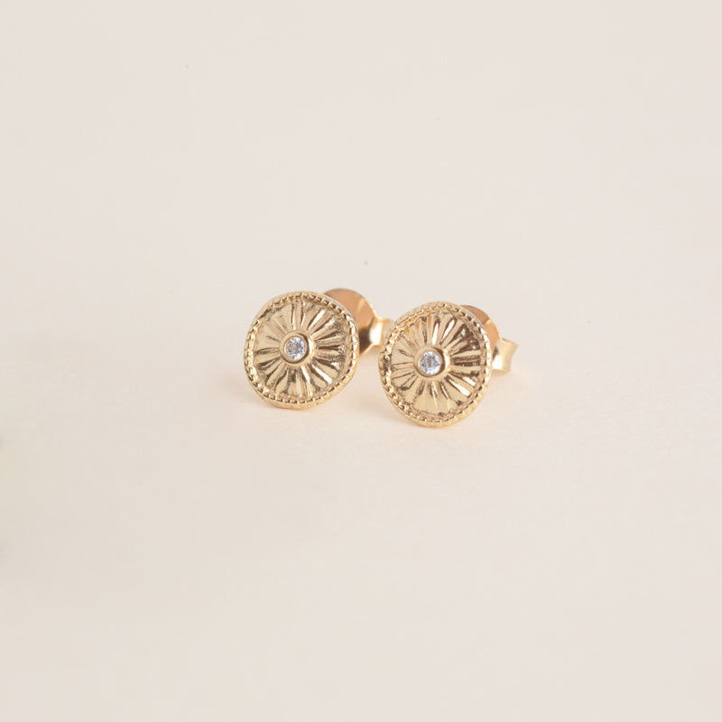 a pair of yellow gold earrings with diamonds